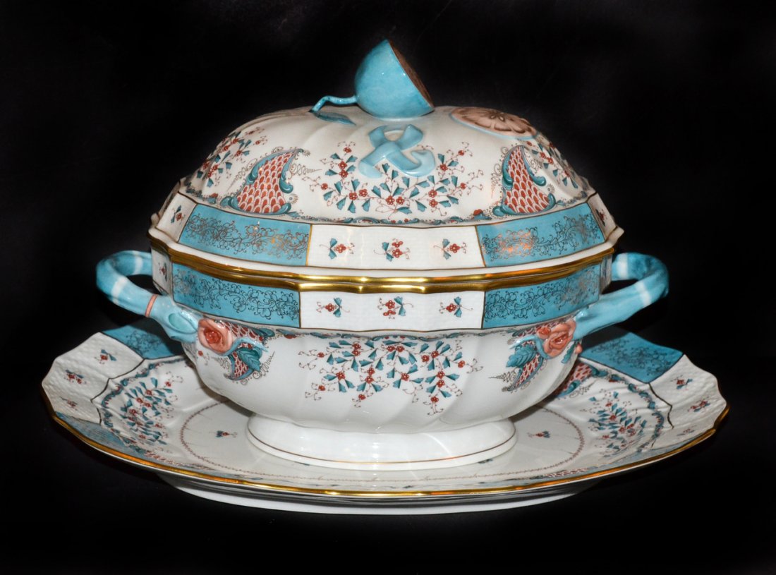 Herend Porcelain Tureen and Underplate: The tureen having molded handles and handle in the form of a halved lemon. In good condition. [9" x 12" tureen] [12 1/2" x 16" platter].