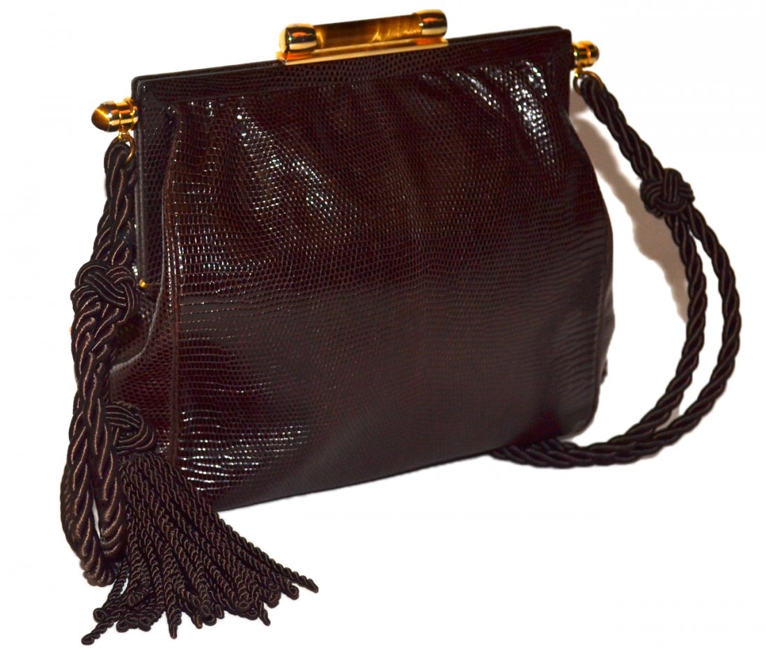 Gucci Brown Lizard Bag: Silk cord shuolder strap, gold tone hardware and faux tiger's eye clasp. Three interior compartments. [7 1/2" w x 2 1/4" d x 7 1/4" h bag only]. Good condition.