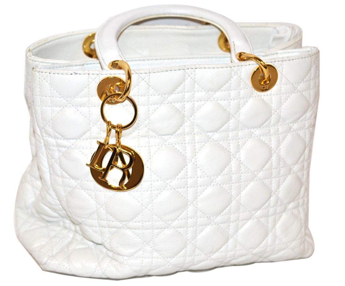 Christian Dior Handbag: Quilted white leather, with gold tone hardware featuring two large interior compartments, one with smaller compartment bearing a zipper closure. [11" w x 3 1/2" d x 9 1/2" h bag only]. Minor scuffs, o