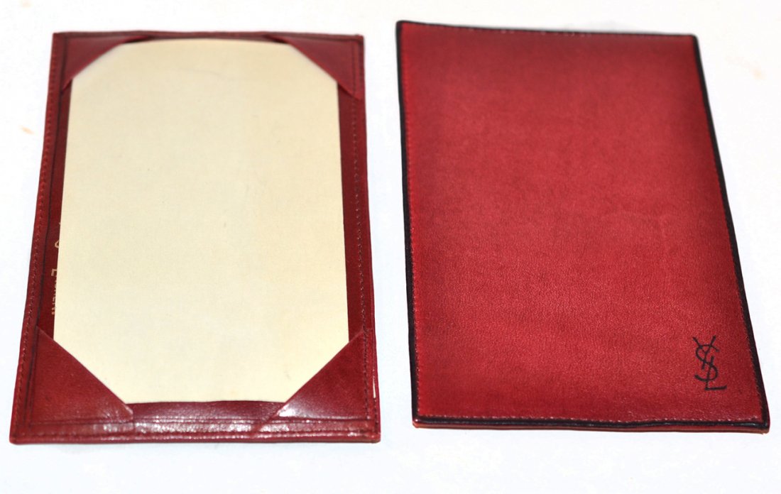 Pair of Yves Saint Laurent Leather Accessories: Billfold/card holders, both in good condition. Presented in original box. [5 3/4" w x 3 5/8" d].