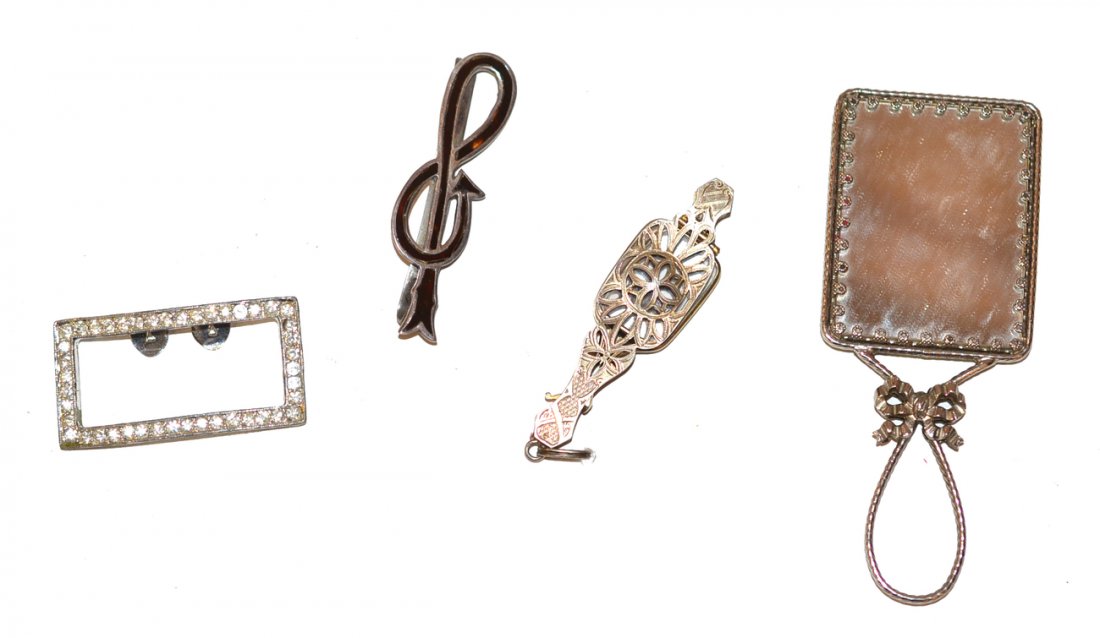 Group of Silver and Silver Plate Articles: Includes silver lorgnette and tie clip, along with silver plated hand mirror and shoe buckle. Buckle missing paste stones, otherwise in good condition.