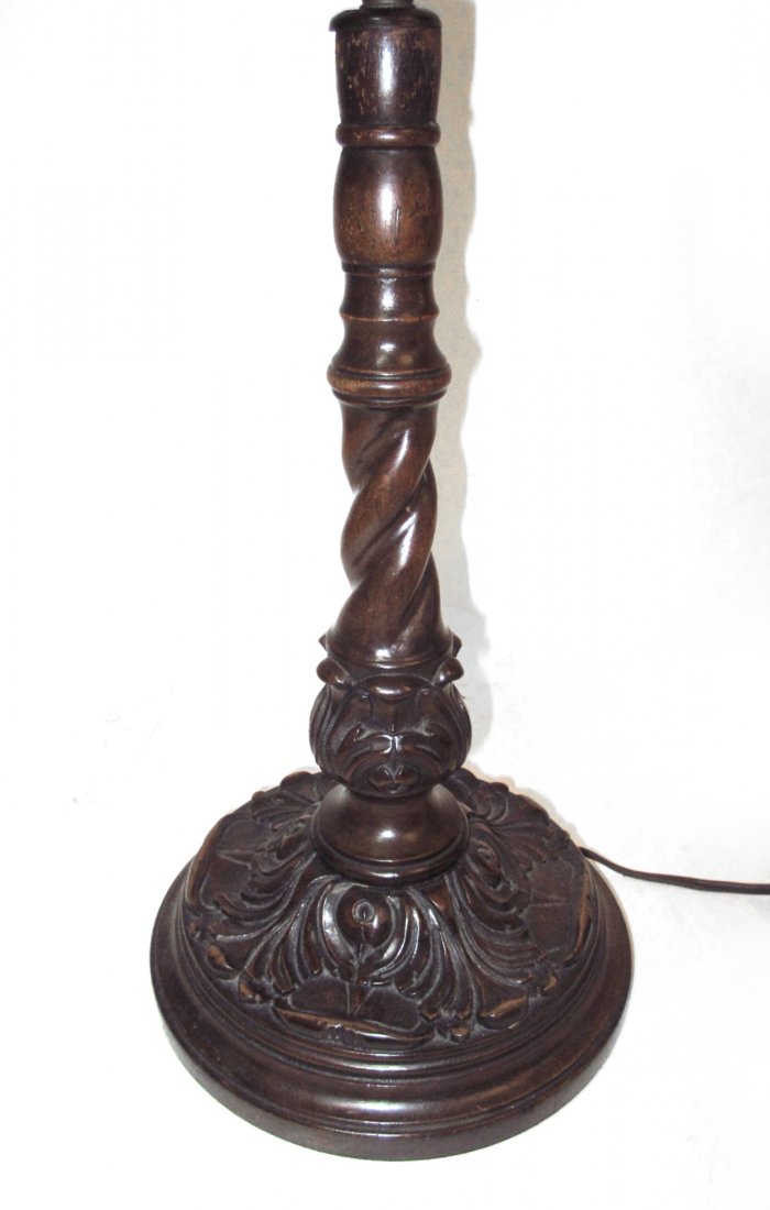 Two Rennaissance Revival Table Lamp: Comprises: 1). Carved mahogany candlestick form lamp with acanthus base. [24 3/4" h]. 2). Brass-finish electrified oil lamp with gadrooning and bladder pattern elements. Both bear wear and minor defec