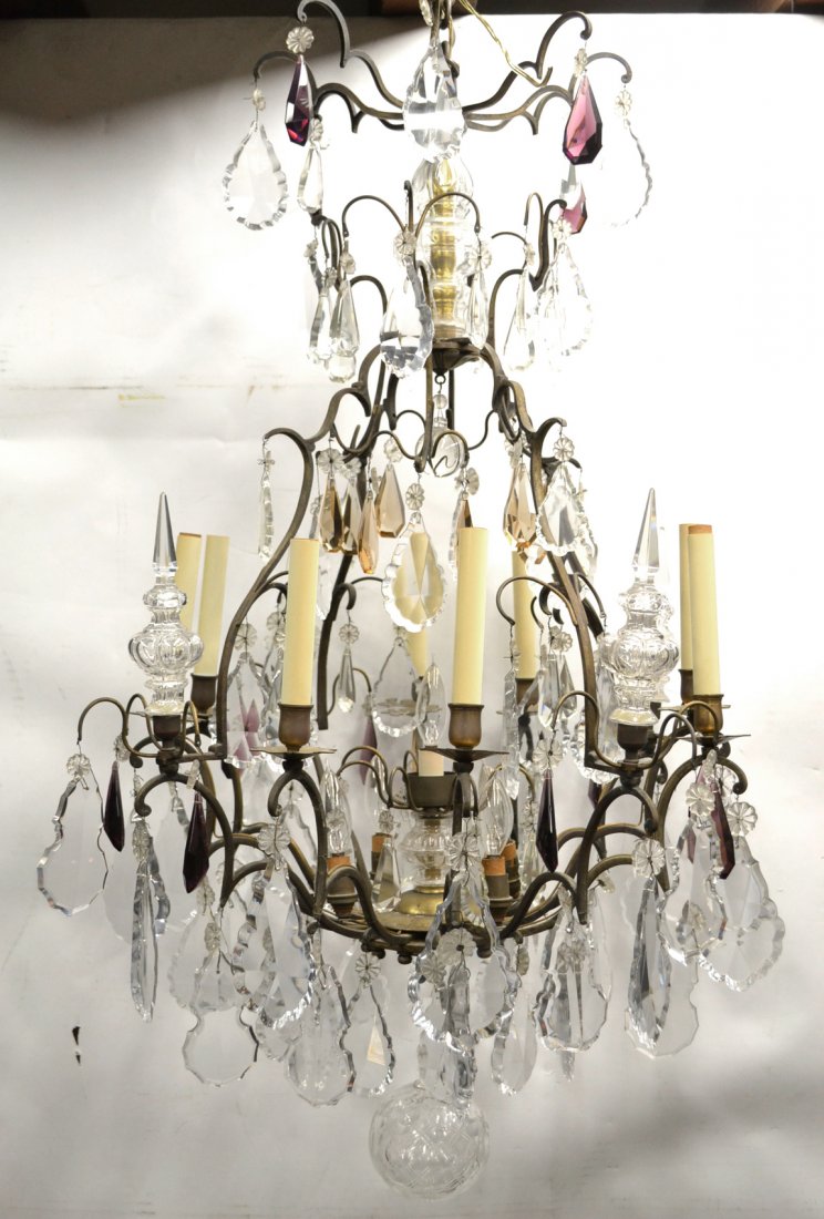 French Iron Fixture: Eight light fixtures, baccarat style prisms. [38" H (approximate) x 24" Dia (approximate)]. Some missing prisms, but no missing topaz or rose crystals. The frame is completely intact and structurally 