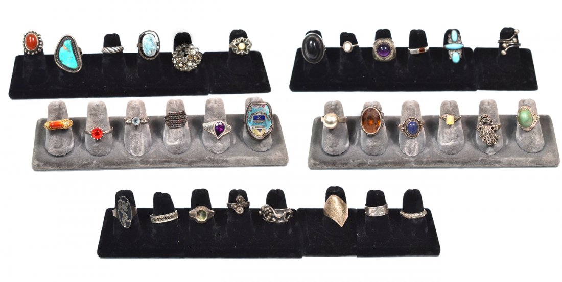 32 Vintage Sterling Rings: Comprises traditional and sculptural settings with tortoise, lapis lazuli, carnelian, amethyst, enamel, and others. Conditions vary. 5.25 ozt inclusive.