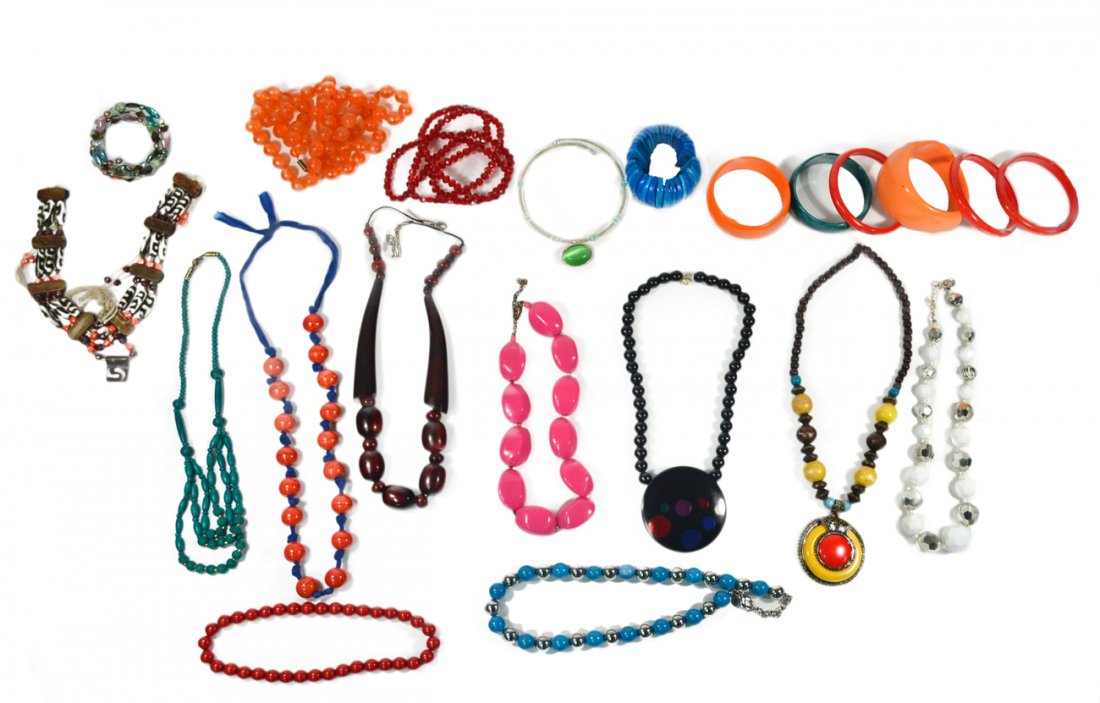 Assorted Colorful Modern Costume Jewelry: Comprises a colorful array of necklaces, chunky bangles, and bracelets. Includes plastic, glass, hardstone and metallic beads. 20+ items.