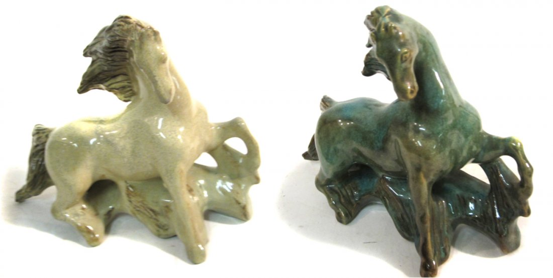 Two Modern Studio Pottery Horses: Comprises two stallions with heads tilted toward proper right and legs about to rear up. One features a mottled blue-brown glaze, the other a speckled khaki. [Each 9 3/4" W x 3 1/4" D x 7 3/8" H]. Bot