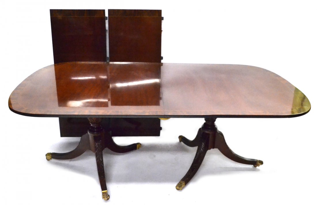 Georgian Style Dining Table: Double pedestal mahogany banded dining room table with two leaves. [29"H. Leaves 18 3/4" each].