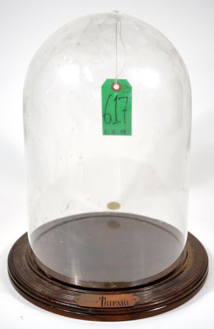 Vintage Trifari Glass Dome Vitrine: Hand blown glass display dome on original maple wood base with engraved plaque inscribed "Jewels by Trifari". [Overall 10 1/8" Dia. x 12 3/4" H].