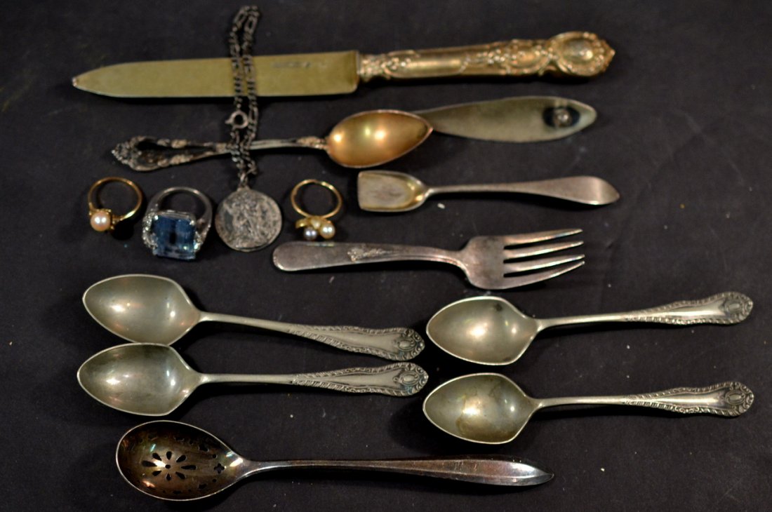 Group of Gold and Silver Objects: Includes 2 gold rings (one Tiffany), along with a small amount of silver flatware and jewelry (7 pieces total). Also accompanied by 7 silver plated spoons and forks. 2.9dwt gold (inclusive), 3ozt silv