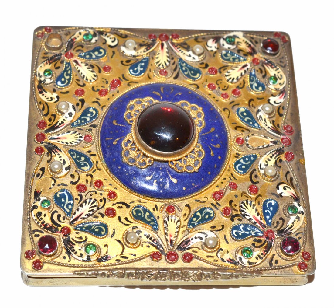 Silver Vermeil Makeup Compact: The hinged cover decorated with enamel and glass jewels, the interior fitted with mirror. One jewel missing. [3 1/4" x 3 1/4" x 3/4" H].