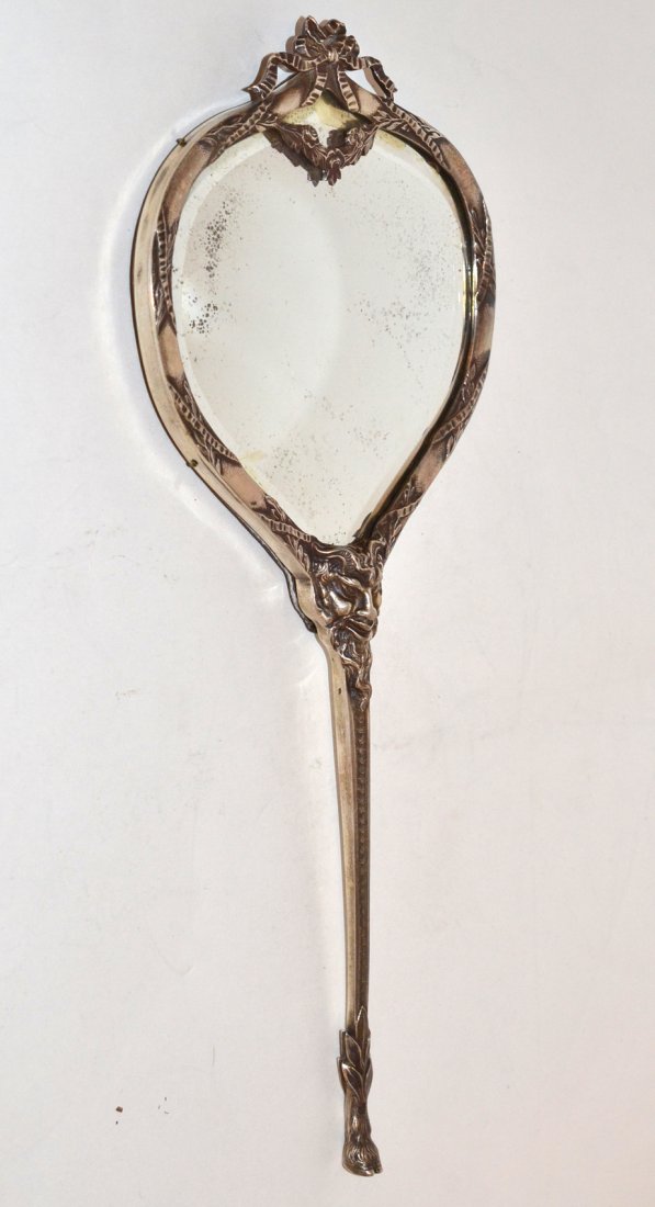 English Silver Hand Mirror: With finely modeled satyr's head and hoof motif, presented in original fitted leather case. [10 3/8" l]