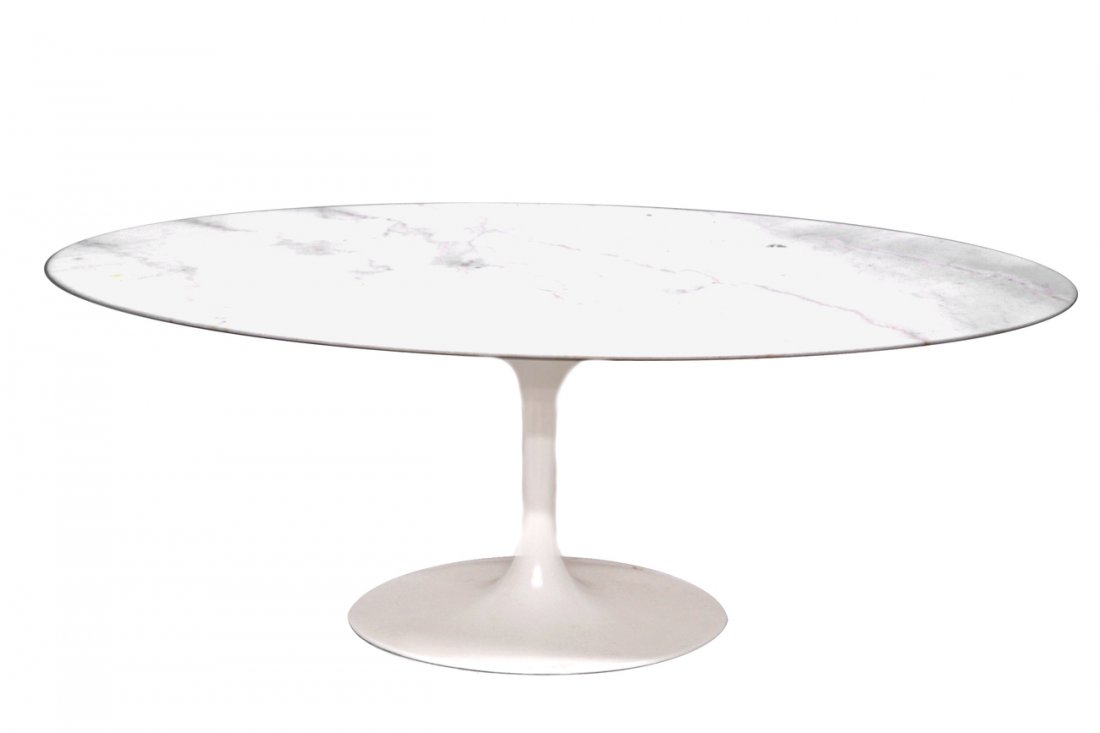 Knoll Oval Dining Table: Eero Saarinen for Knoll dining table with white oval top. Recent manufacture. [76" W x 47" D x 27 1/2" H]. Two small chips (approximately 2") along marble edge.