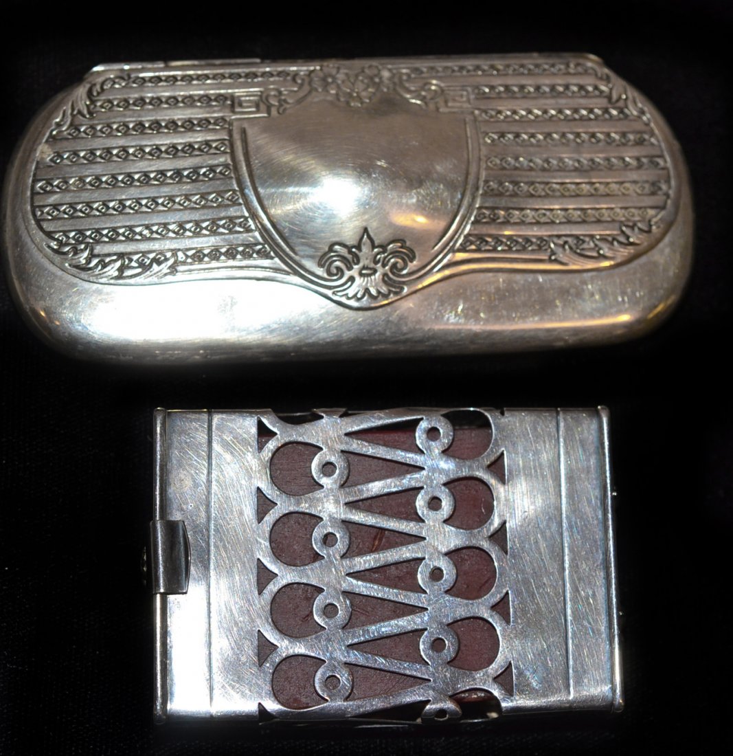 Two Silver Cases: The first for eyeglasses, the second in rectangular form with reticulated band. Both in good condition. [Larger: 4 1/4" L]
