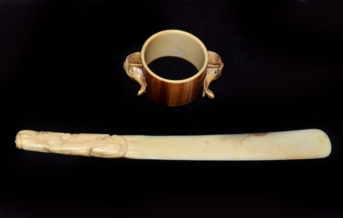 Two Antique Ivory Articles: Includes letter opener and napkin ring. In good condition. [8 3/8" length of letter opener]