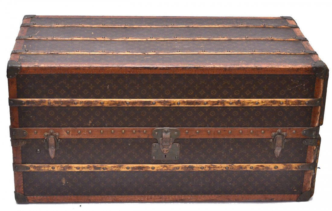 Louis Vuitton Vintage Trunk [Hugette Clark]: Fitted with six interior drawers and a clothes hanging system. [44" W x 21 5/8" D x 21 3/4" H]. Bears a bold red painted "H.M.C." monogram [owned by copper heiress Huguette Marcelle Clark with handwri