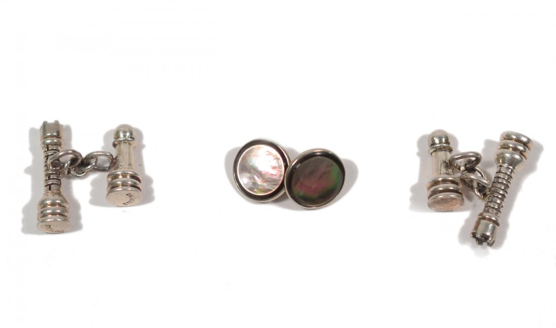 Pair of Silver and One 14k Cufflink: The pair in the form of chess pieces and modeled in silver; the single cufflink of 14k gold and abalone. Good condition.