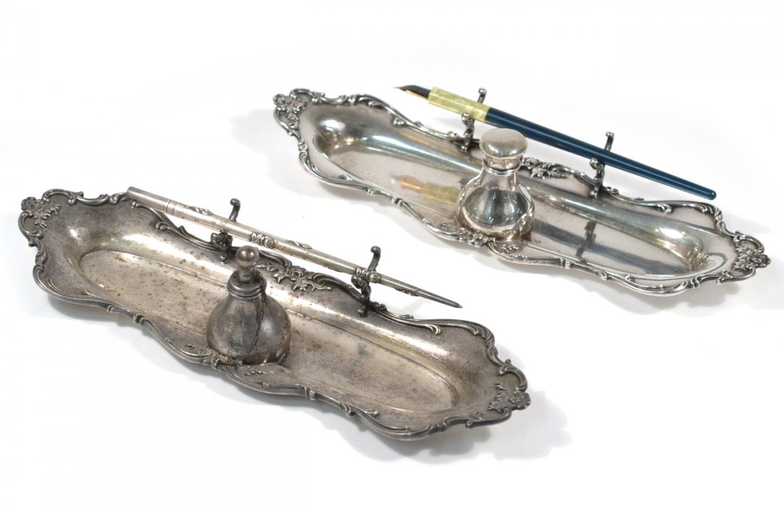 Two Gorham Sterling Silver Pen Stands: One with attached ink bottle, the other with attached oil lamp. Includes two pens (one sterling). [10 1/4"L]. 11ozt.