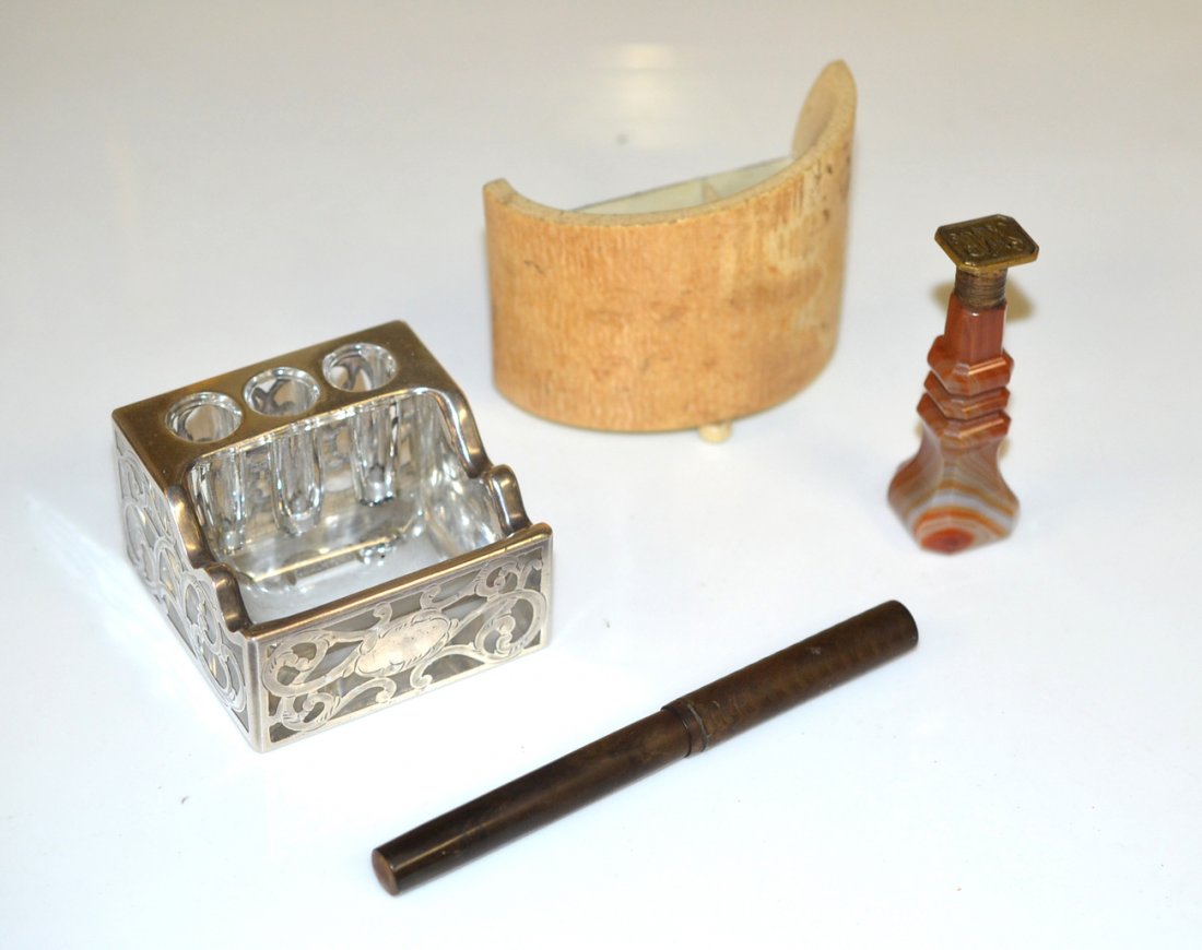 Group of Four Desk Articles: Comprises silver overlay pen stand, ivory pen holder, agate wax seal, and a vintage Waterman pen. The number "16" is tamped on the base of the barrel and there are traces of red paint. [5 1/2" L]. Ove