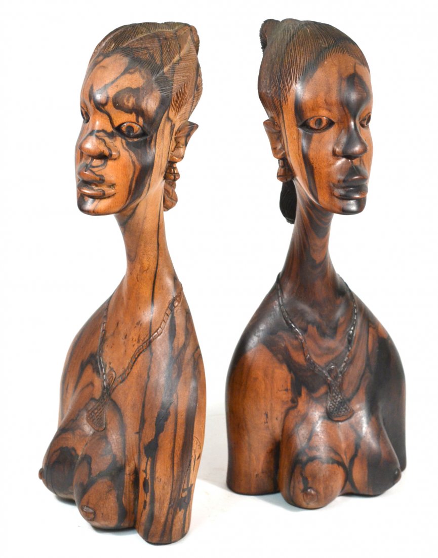 P. Akoko, Pair of African Carved Wood Figures: Each in the form of a woman's bust, carved from macassar ebony. [18 1/4" H]. Signed "P. Akoko" on bottom. In good condition.