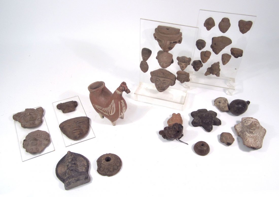 Group of 31 Pre-Columbian Artifacts: Includes masks, architectural elements and animal-form vessel. Some mounted on acrylic panels. [Largest: 4 1/2" H x 4 1/2" W x 2 1/4" D]. Condition as with age.
