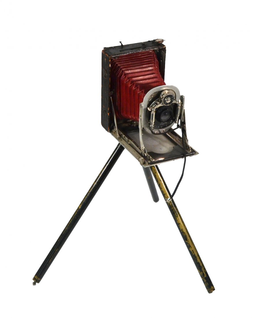 Antique View Camera on Tripod: Leather and metal covered hard cased camera with red leather bellows.