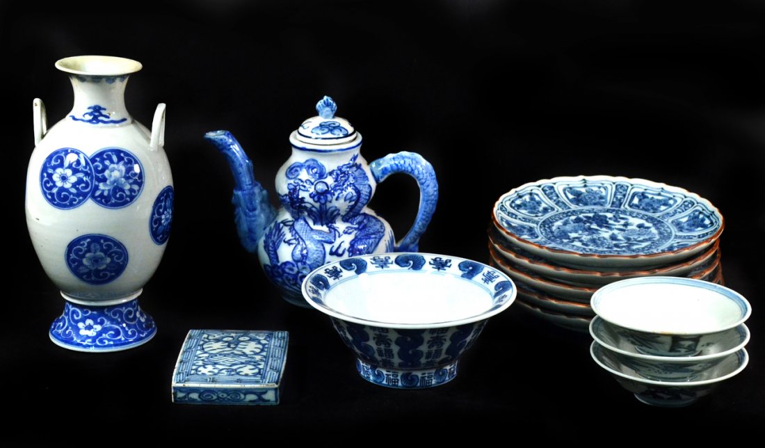 Group of Chinese Blue & White Porcelain: Includes vase, teapot, plates, bowls, and box cover. 12 pieces. [8 1/2" H]. Older restoration on vase, teapot cover replaced. Otherwise good condition.