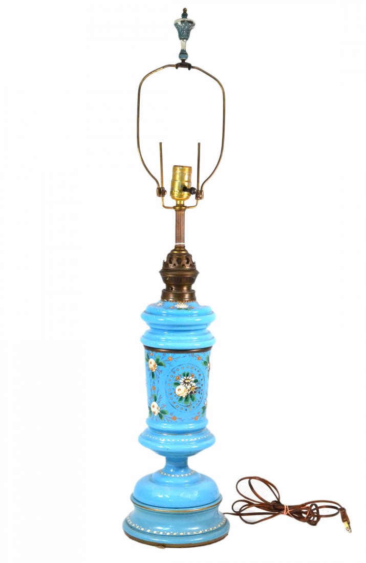 Blue Opaline Glass Lamp: With painted gilt floral decoration on wood base. [Overall: 34" H]. Decoration worn but otherwise good condition.