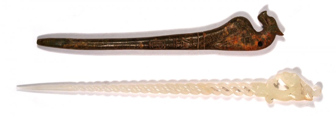 Two Chinese Carved Jade Hairpins: Comprises: 1.) mutton fat jade double twist open-work hairpin with phoenix head terminus [8 1/2" Long], 2.) jade hairpin with dragon head terminus [7 3/4" Long].