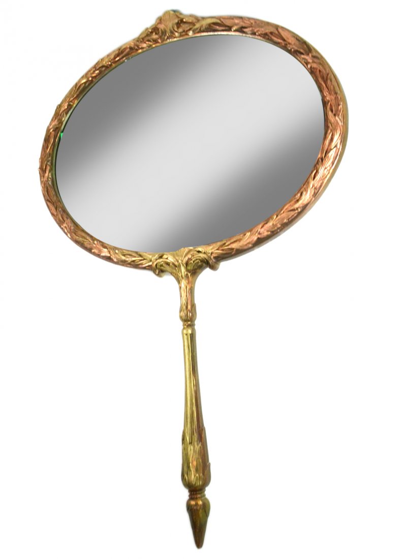 Gilt and Molded Plastic Mirror: Whimsical wall mirror in the form of a ladies hand mirror.