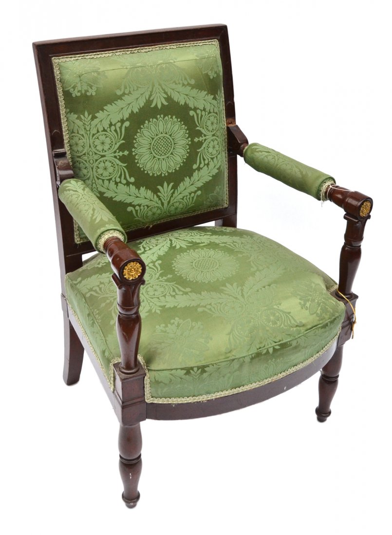 Antique Empire Open Armchair: Mahogany frame with turned and upholstered arms bearing gilt bronze rosette terminals and splayed back legs. Bears green silk upholstery. [24 3/4" W x 21 1/2" D x 36" H; 17 1/2" H to seat]. Chip with 