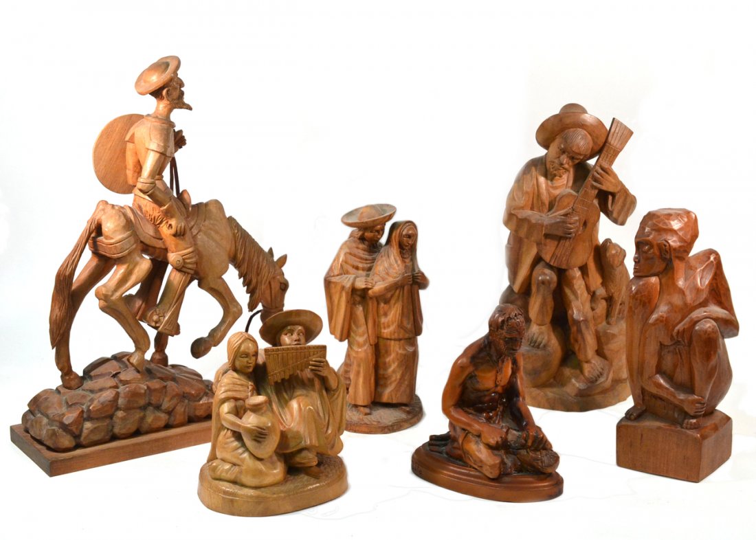 International Wood Sculpture Group: International carved wood sculpture group of 6. Comprises: 1.) South American couple with pan flute. [8 1/4"H]. 2.) Chilean crouching figure. [12 1/4"]. 3.) New Zealand figure of a traditional wood ca