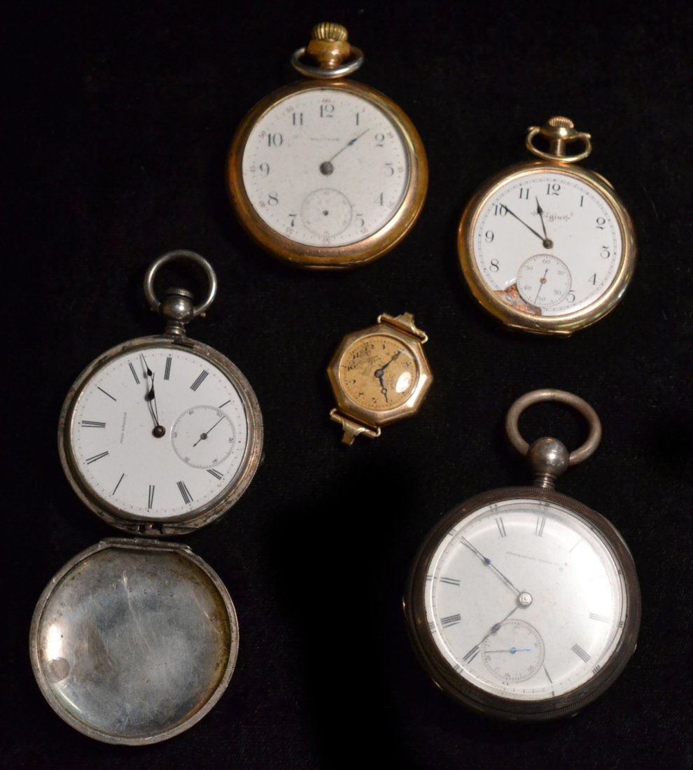 Four Pocket Watches and Wristwatch: Comprises: 1.) Springfield Watch Co. "Currier" pocket watch with silver plate case, 2.) Jules Huguenin pocket watch with sterling plate case (missing crystal, hands bent, and lid detached, 3.) Elgin 1