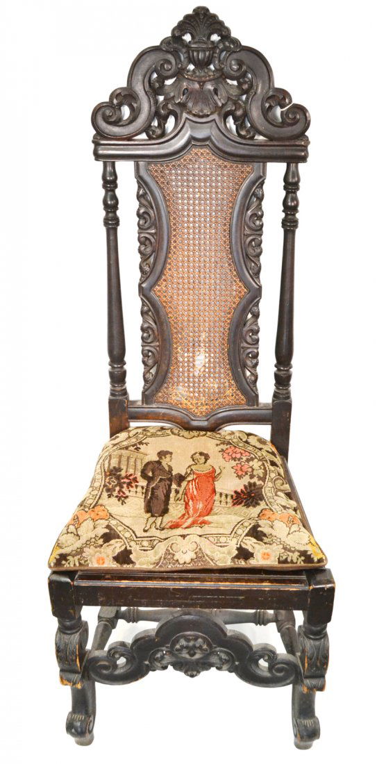 Spanish Colonial-Style Side Chair: 1920's American carved and turned wood side chair with caned side and seat. Accompanied by custom needlepoint cushion. [20" W x 19" D x 52 1/2" H; 17 1/2" H to seat]. Scratches and loses to wood and c