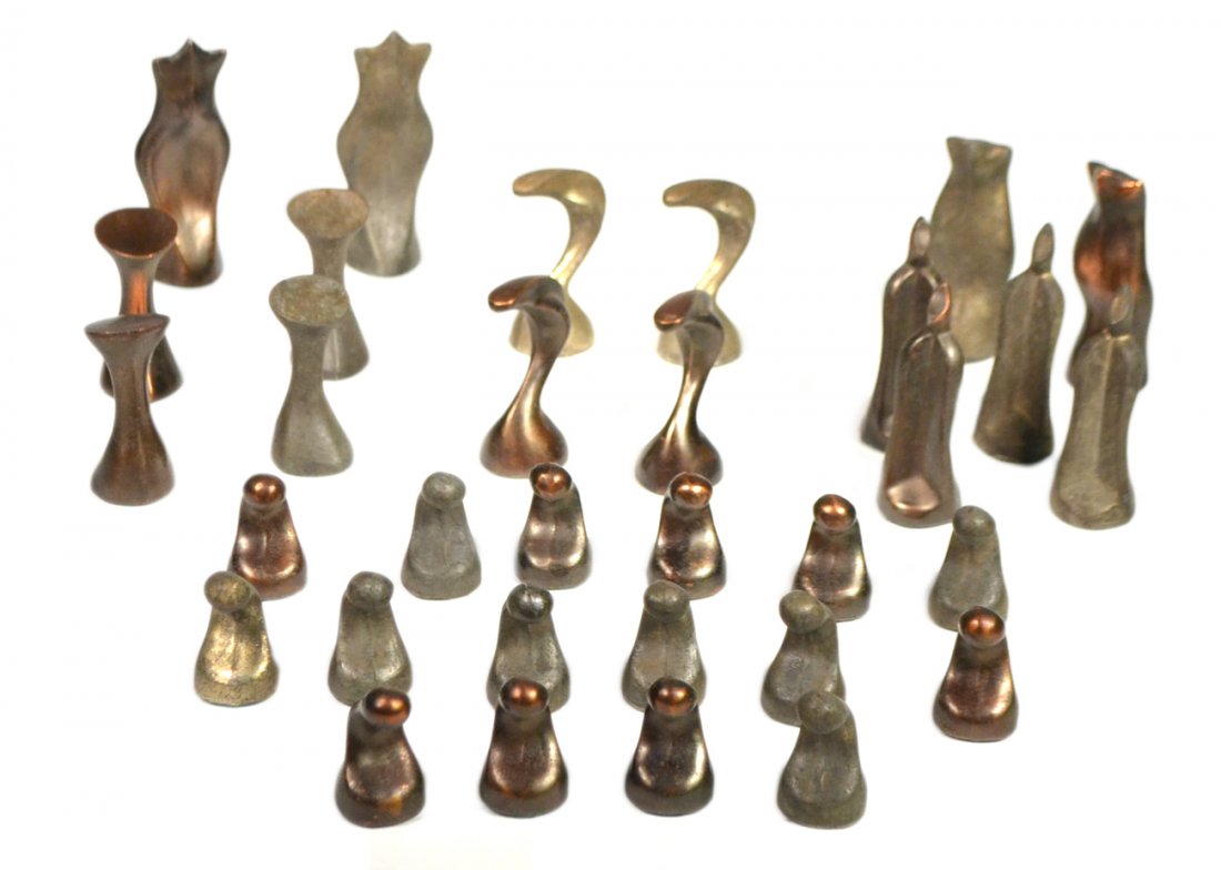 Modern Sculptural Chess Set: Vintage abstract cast aluminum chess set in the manner of Henry Moore. Comprises copper and bronze-finish patinas. 32 pieces total. [Kings: 4" H; Pawns: 2" H]. In good condition. Unfortunately, there