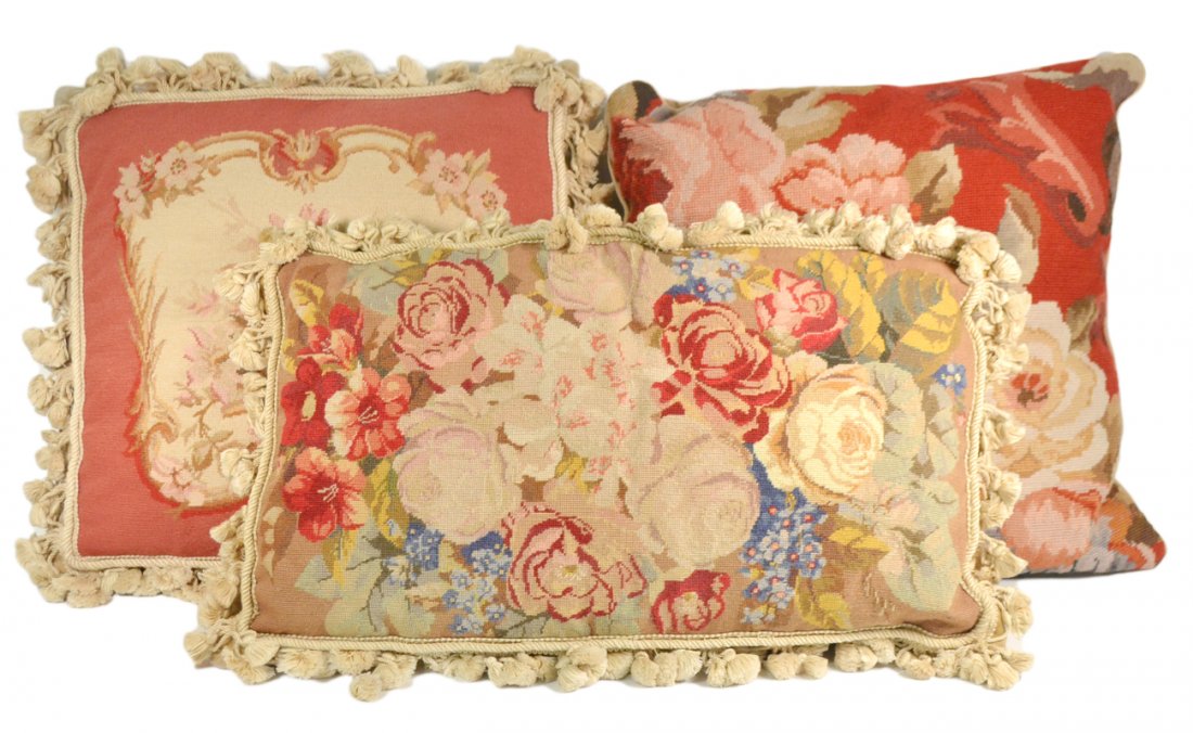 3 Needlepoint and Petit Point Cushions: Each with floral decoration. [19" x 19", 14 1/2" x 25", 19" x 19"].