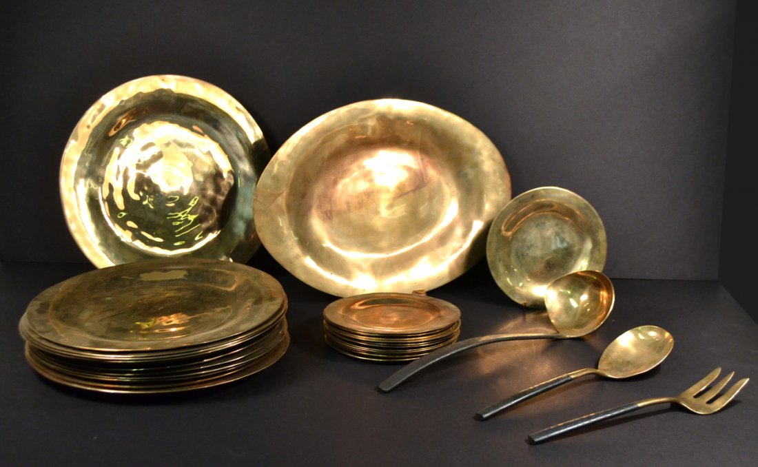 30-Piece Bronze Partial Dinner Service: Polished and patinated hammered bronze partial dinner service comprising 12 dinner plates, 12 bread & butter plates, 3 serving plates and 3 serving utensils. [Dia of dinner plates: 11 3/8"]. Some scra