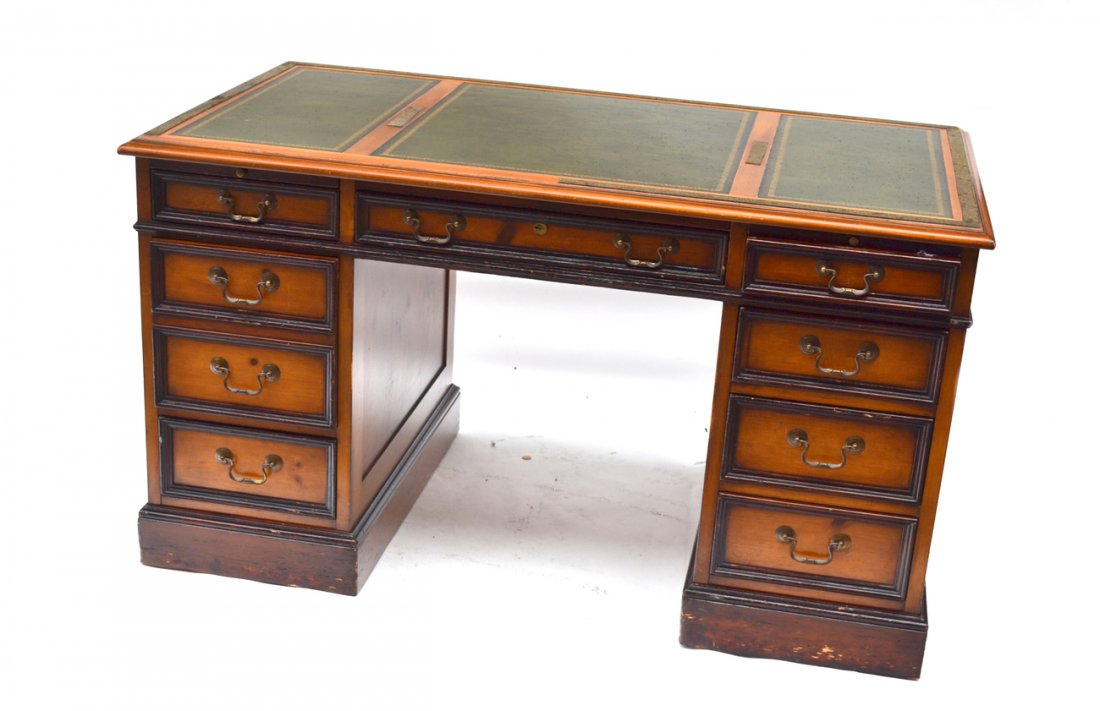 Executive Desk: Mahogany and tooled leather eight drawer executive desk, by Sligh Furniture Co. [54" D x 30" D x 30" H]. Base scratched, scratches on leather, overall good condition.