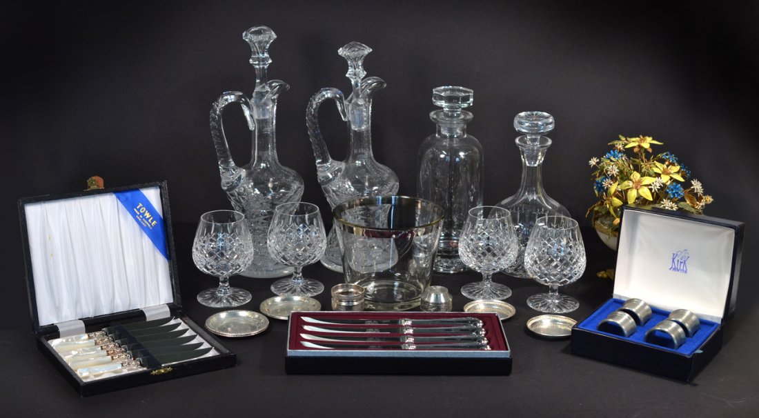 Group of Glass & Metal Decorations: Includes crystal decanters and stems, silver-plated and pewter articles, and an enameled and gilt metal floral arrangement. 21+ pieces. Overall good condition. Sterling plates in the 7th photo are nut