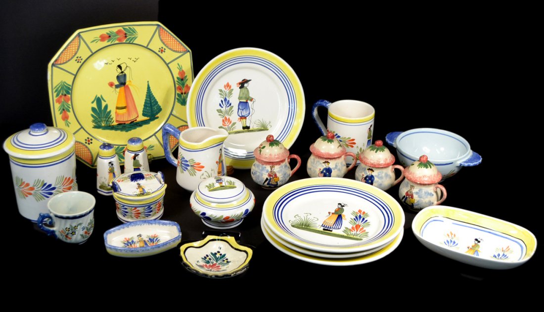 Group of Vintage Quimper Ceramics: Comprises an assortment of covered cups, plates, jars, canister, pitcher, coffee cup, and more. Flakes and chips. (21 pieces).