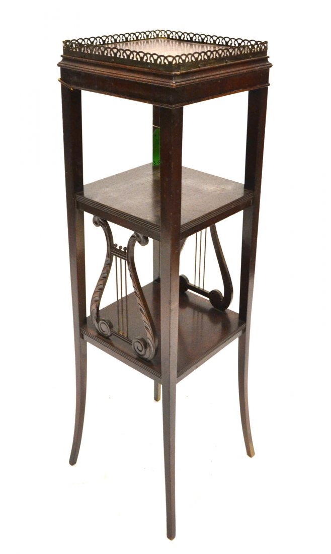 Duncan Phyfe-Style Pedestal: Mahogany three-tier open pedestal with a galley top. [14" x 14" x 41 1/2" H]. Worn with losses.