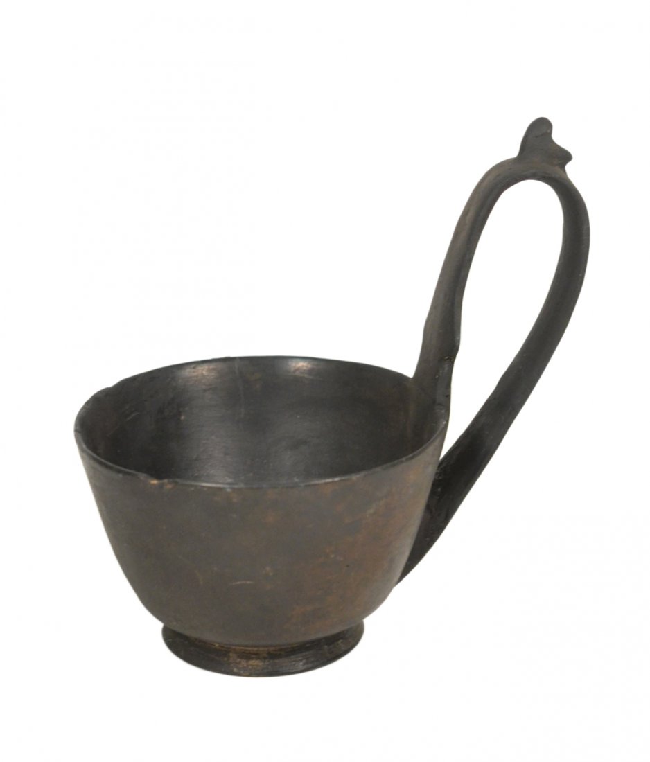 Ancient Greek Kyathos: Black slip covered ceramic drinking cup. [5 5/8" H]. Partial crack & chipped rim