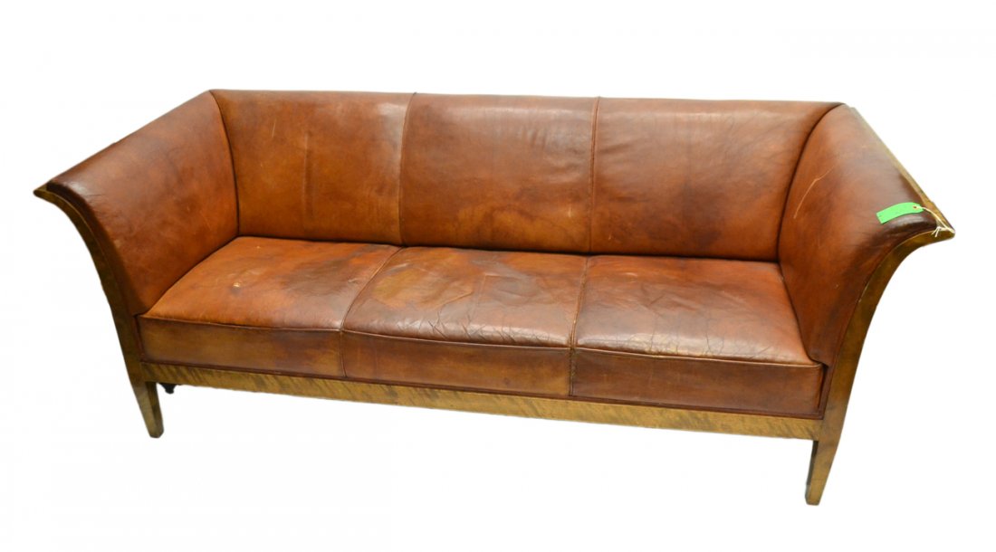 Empire-Style Sofa: Mahogany leather upholstered sofa. [79" L x 33 1/2" D x 29 1/2" H]. Good as with age, some wear to upholstery.