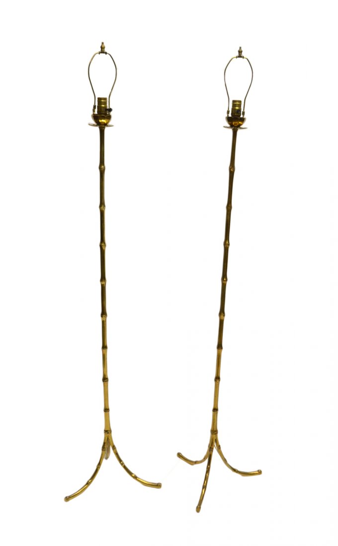 Pair of Floor Lamps After Bagues: Pair of floor lamps after Bagues. [56" H x 15" Dia]. Wear consistent with age and use including scuffs, areas of light pitting, and worn finish. Base of one lamp has been expertly repaired. Unmarked.