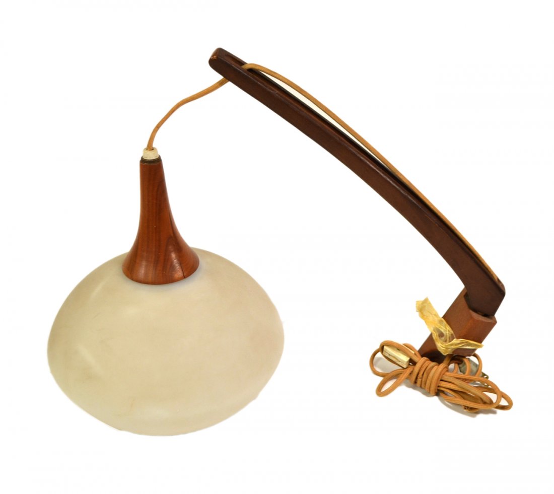 Scandinavian Type Light Fixture: Wall-mounted light fixture with sculptural walnut swing arm and frosted glass shade. [20"W x 10"D x 16 1/2"H]. Scuffs and light soiling.