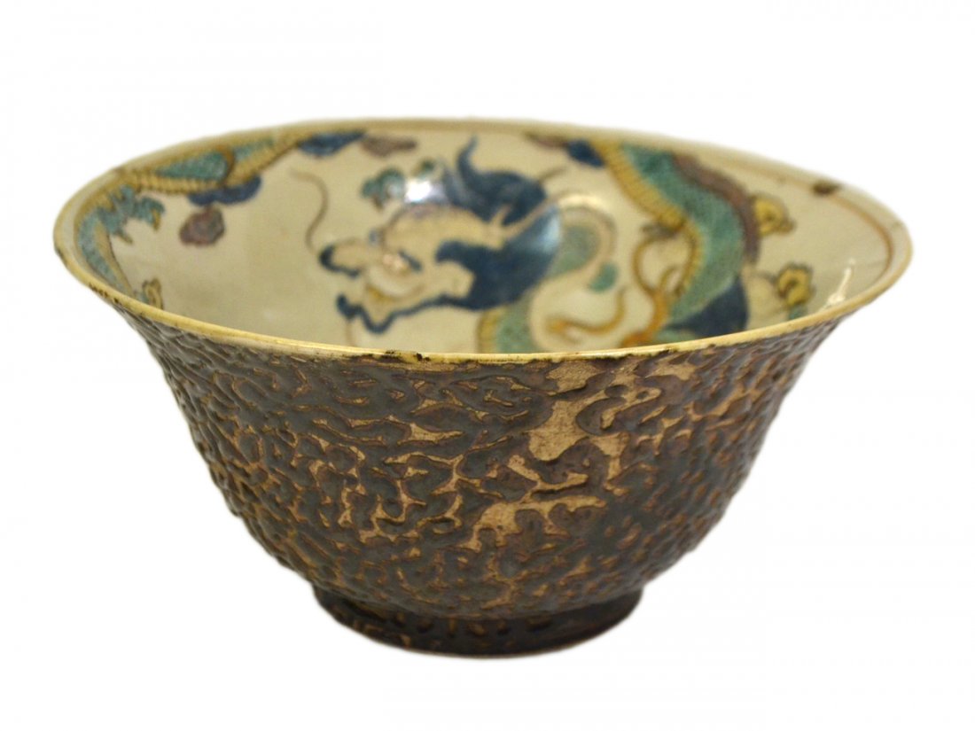 Japanese Studio Pottery Bowl: The interior painted with a dragon bearing an anthropomorphic face. The exterior with a dark brown "crawling" glaze. Base bears single ring and six-character mark. [8 1/2" dia x 4" H]. Partial crack a