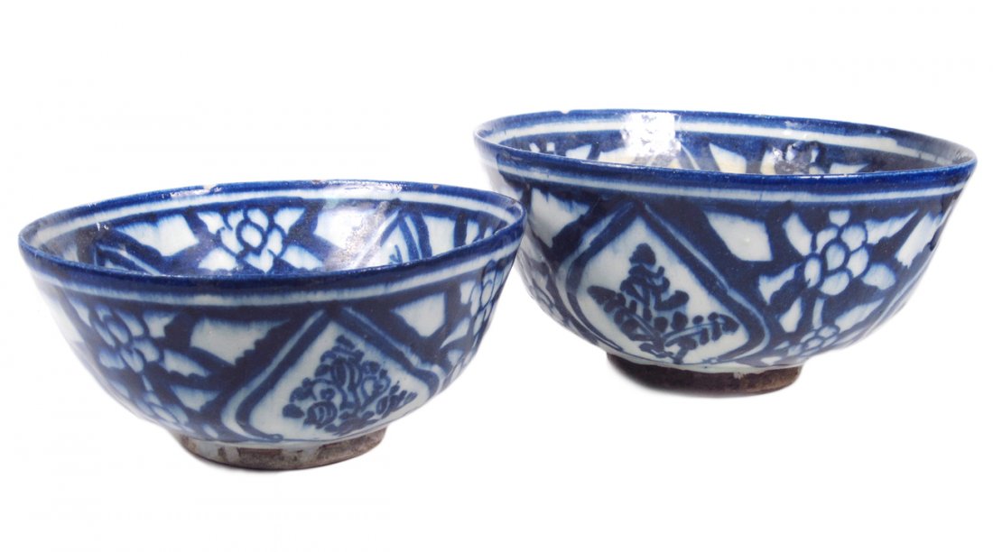 Two Antique Islamic Bowls: Blue and white tin-glazed earthenware bowl. [Larger: 8 7/8" Dia x 4 3/8" H]. Chips and cracks.