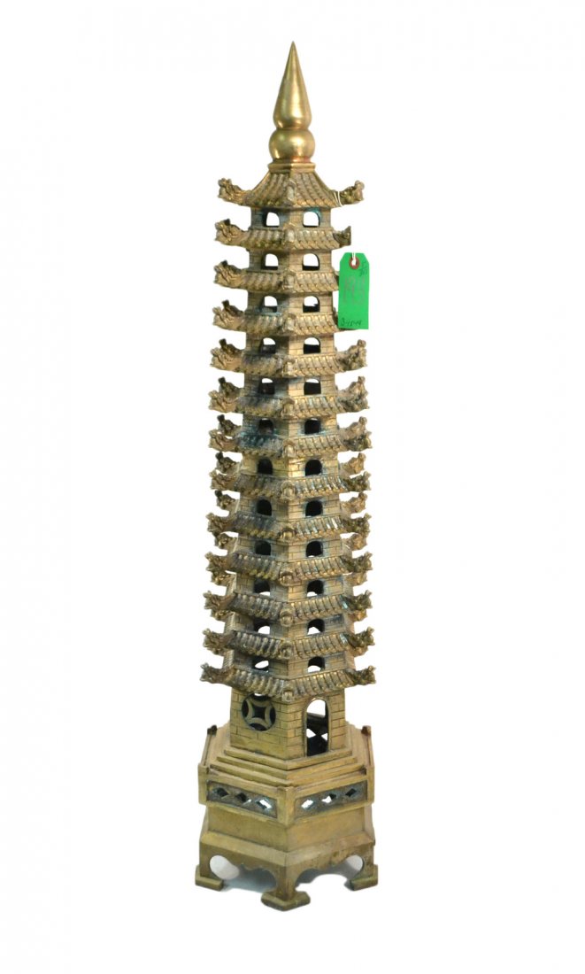 Asian Bronze Architectural Model: An Asian pagoda multiple tower with foo lion ornaments. [39" H x 10" L]. Good condition.