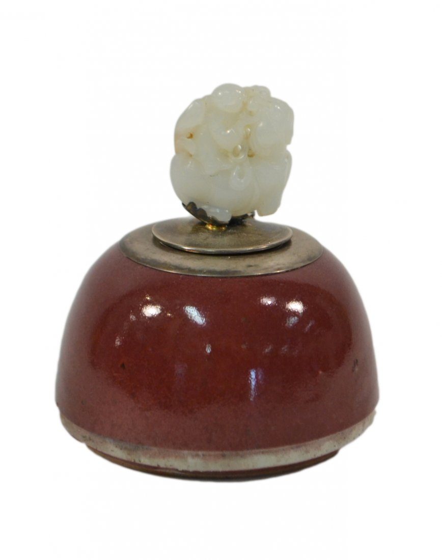 Chinese Sang de Boeuf & Jade Inkwell: Dome-form sang de boeuf glazed ceramic inkwell with silver plate fittings and glass liner. Features a carved mutton fat jade finial depicting a child on horseback. [4" Dia x 4 3/8" H]. Bottom drilled,