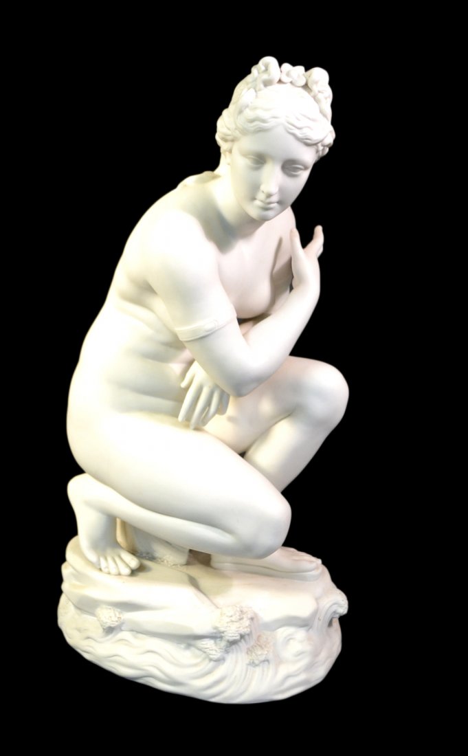 Belleek Bisque Porcelain Female, Nude: Full-length kneeling neoclassical female nude seated upon a shell on rocky base. Stamped on bottom "Belleek...". [7 5/8" W x 10 1/8" D x 18 1/8" H]. Bears small restoration on base (below knee) and on