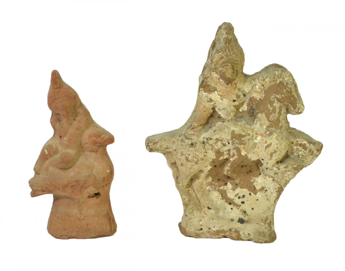 2 Ancient Egyptian Terracotta Horus Figures: Core-formed devotional objects comprising: 1.) Horus on the back of a rearing horse. [7 1/4" W x 2 5/8" D x 9 1/4" H]. 2.) Horus reclining on the back of a large standing bird. [3 3/4" W x 1 7/8" D x